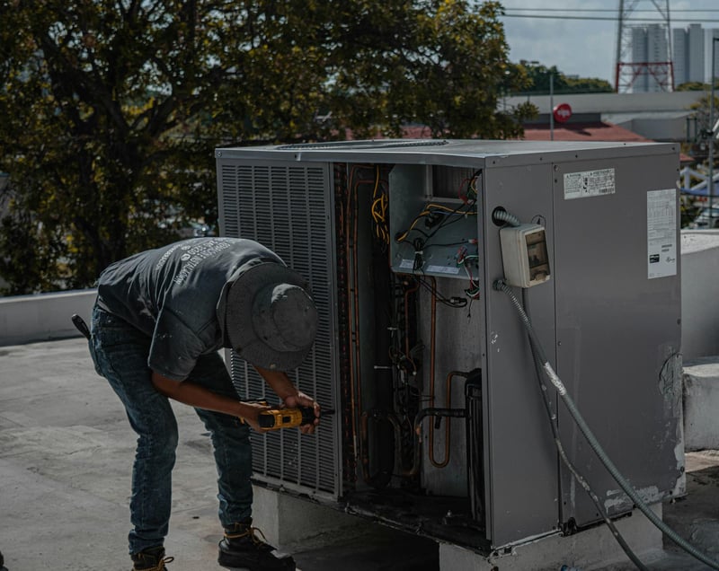 HVAC technician on the job while Callspace handles incoming calls